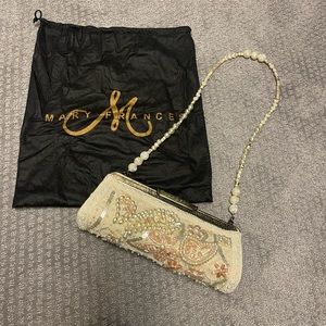 Mary Frances cream and gold clutch with pearl strap and dust bag.